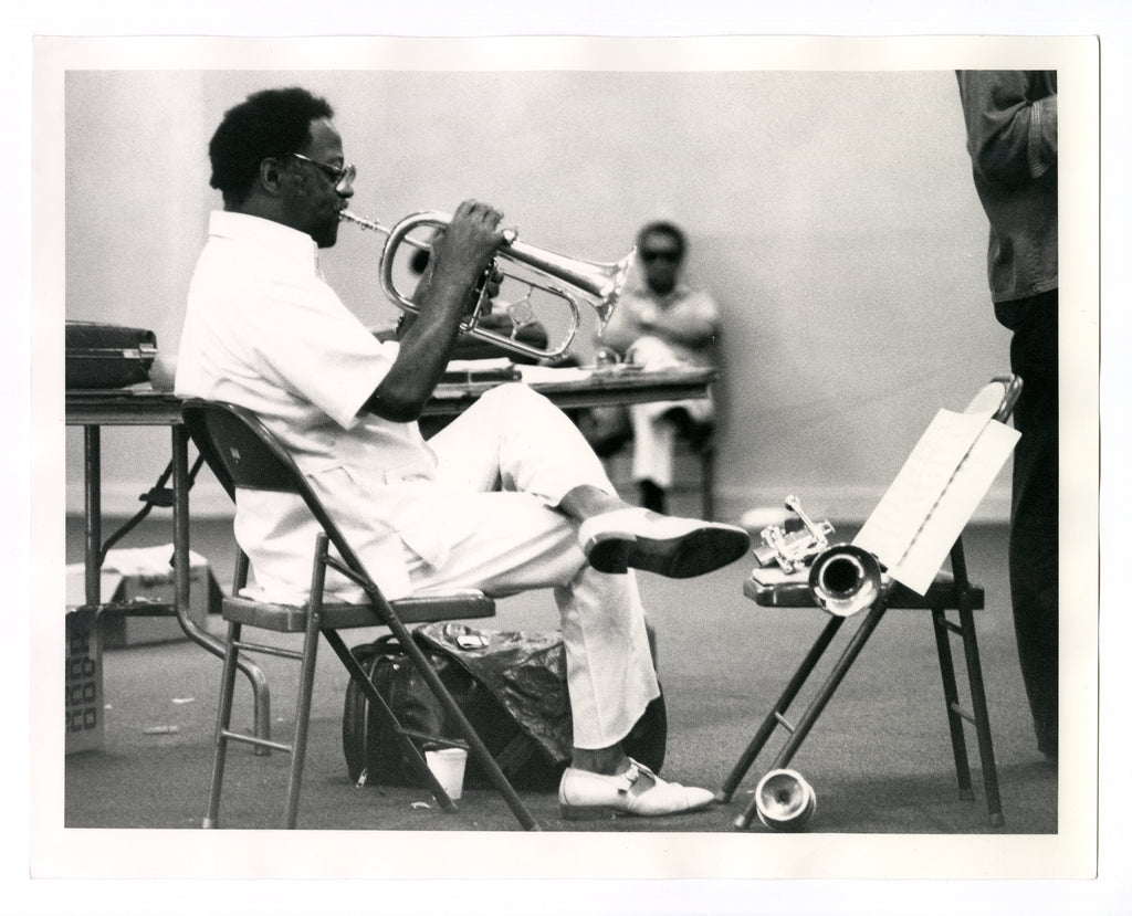 CLARK TERRY PLAYING A TUBA DURING A REHEARSAL AT THE MONTEREY JAZZ FESTIVAL, CA, 1981 BY TED WILLIAMS
